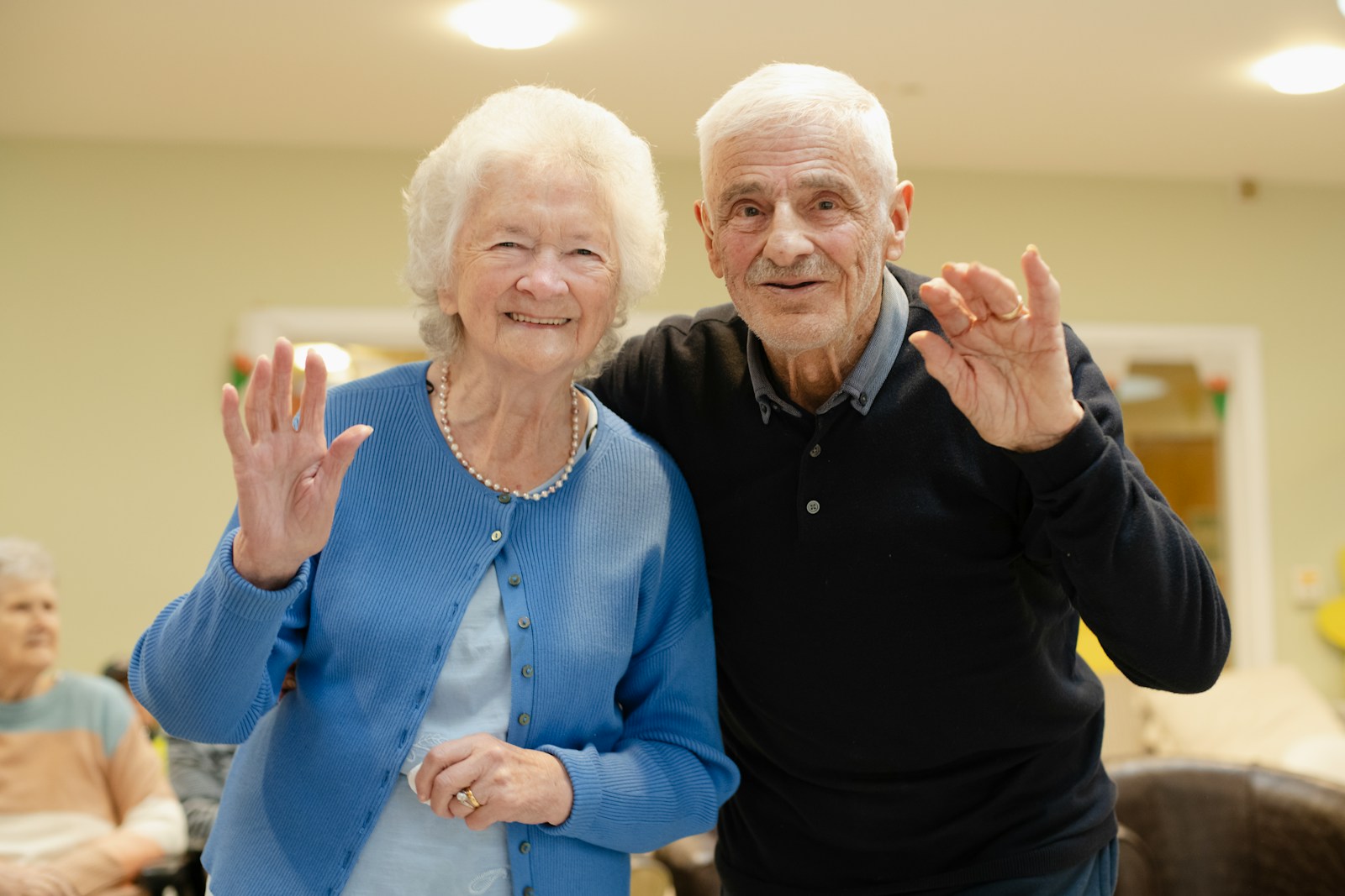 An older couple together in a familiar indoor setting