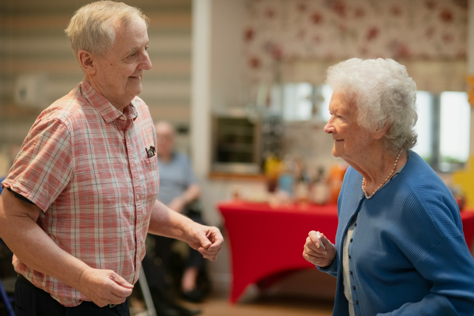 Two older adults enjoying a social activity together